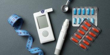 diabetes-accessories-on-black-background-top-view-2021-09-02-22-22-15-utc-768x512